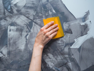 Hand puttied wall. Creative wall decoration during construction and repair. Close up.