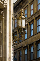 decorative street lamp on an old building in europe