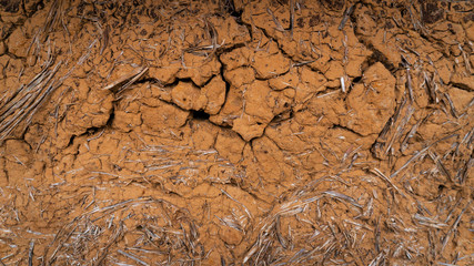 old antique clay wall, mud hut, cracked clay