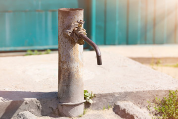 Old water tap, outdoors