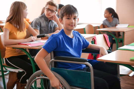 Boy in wheelchair in classroom at school