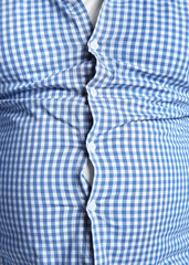 Overweight person in tight clothes, closeup