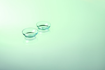 Contact lenses on color background
