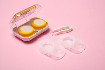 Contact lenses and accessories on color background