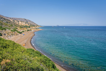 Sunny beautiful summer coast view to the greek blue sea white pure dark brown sand perfect for holiday relaxing swimming playing , Pachia Ammos Beach, Kos, Nisyros Island, Dodecanese/ Greece