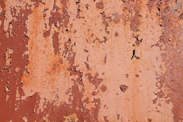 Old sheet of iron with peeled red paint. Background. Texture.