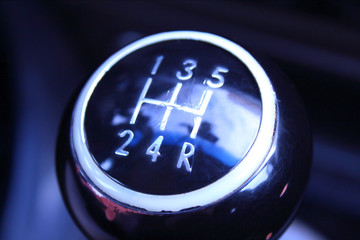 Shabbed shift lever on the car. The lever of a mechanical transmission. Close-up. Background.