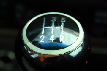 Shabbed shift lever on the car. The lever of a mechanical transmission. Close-up. Background.