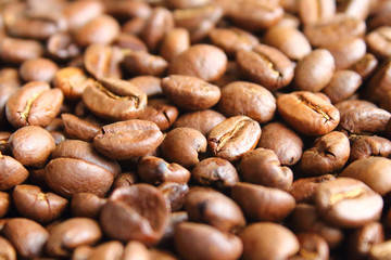Coffee natural fried in arabica beans. Close-up. Background.