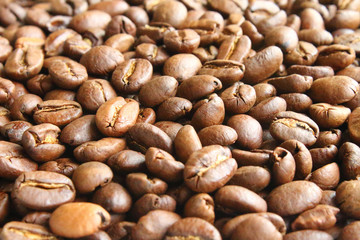 Coffee natural fried in arabica beans. Close-up. Background.