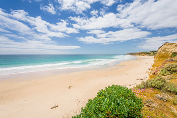 Sunny beautiful summer coast view to the blue sea and pure white sand beach dune limestone sandstone rocks perfect for surfing swimming and hiking, Star of Greece, Port Willunga, Adelaide, Australia