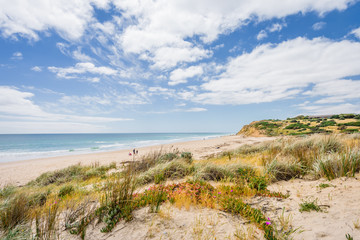 Sunny beautiful summer coast view to the blue sea and pure white sand beach dune limestone sandstone rocks perfect for surfing swimming and hiking, Star of Greece, Port Willunga, Adelaide, Australia