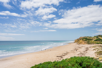 Sunny beautiful summer coast view to the blue sea and pure white sand beach dune limestone sandstone rocks perfect for surfing swimming and hiking, Star of Greece, Port Willunga, Adelaide, Australia