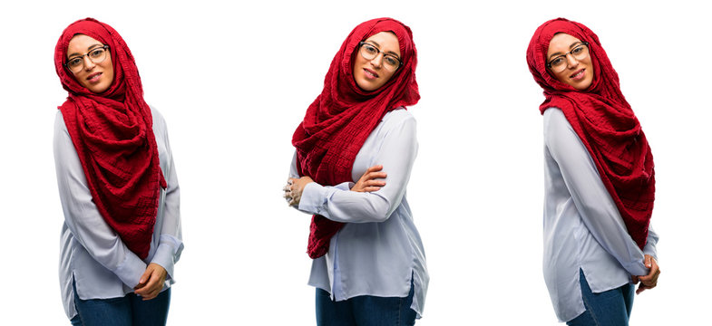 Arab woman wearing hijab confident and happy with a big natural smile laughing, natural expression isolated over white background