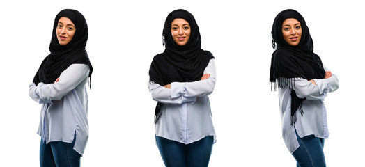 Arab woman wearing hijab with crossed arms confident and happy with a big natural smile laughing isolated over white background