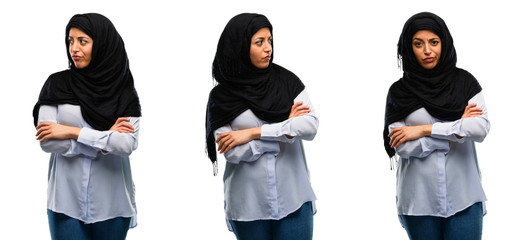 Arab woman wearing hijab irritated and angry expressing negative emotion, annoyed with someone isolated over white background