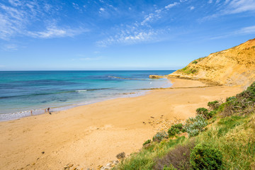 Sunny beautiful summer coast view to blue sea and pure white sand beach dune limestone sandstone rocks perfect for surfing swimming hiking, Great Ocean Road, Torquay, Melbourne, Victoria, Australia