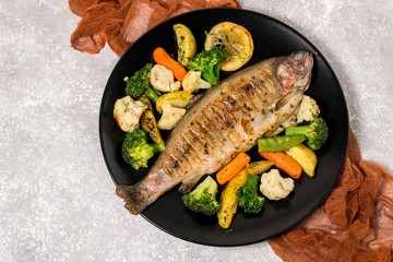 Trout baked with vegetables