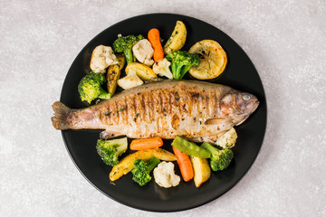 Trout baked with vegetables