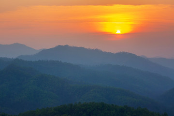 Obraz premium Aerial view of mountain range with warm sunlight, shade and shadow, sunset sunrise from Mae Hong Son province Thailand