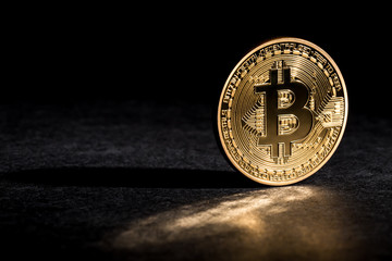 Bitcoin cryptocurrency coin on a dark background