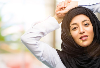 Fototapeta premium Young arab woman wearing hijab confident and happy with a big natural smile