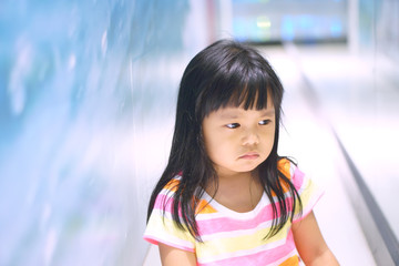 Asian children cute or kid girl upset or angry and sad feel with touchy for buy toy in department store
