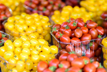 Background of fresh  red and yellow cherry tomatoes