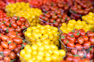Background of fresh  red and yellow cherry tomatoes