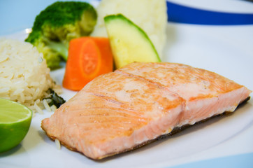 Salmon served with vegetables