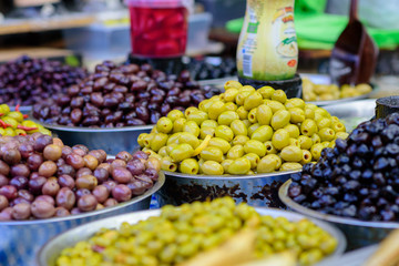 Green and black olives in the oriental market Carmel, Tel Aviv, Israel