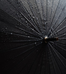Umbrella in water drops close up