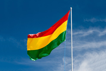 Bolivia Flag under sunny blue sky