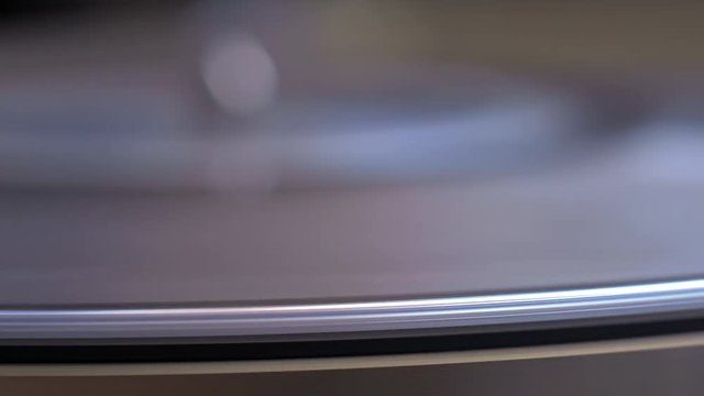 Extreme close up of stylus dropped onto spinning record