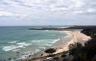 Duranbah beach and breakwall at the entrance of Tweed River on a cloudy day. Duranbah Beach, officially known as Flagstaff beach is the most northern beach in New South Wales.