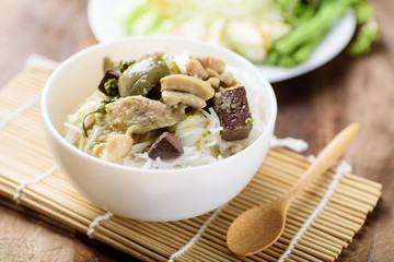 Thai food, rice noodles with green curry chicken (Kanom Jeen Kang Keaw Wan Gai)