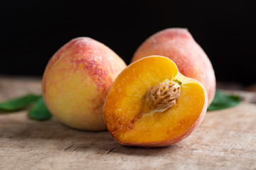 Ripe peaches on wooden, tropical fruit