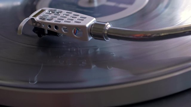 Close up shot of vinyl record turntable playing music