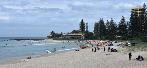 Fototapeta premium Coolangatta, Australia - Dec 26, 2017. People relaxing and sunbathing on Rainbow Beach.