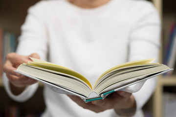 Asia woman reading book in library