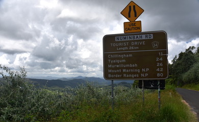 Numinbah Rd, Australia - Dec 27, 2017. Tourist Drive 34 on Numinbah Road. Springbrook National Parks mountains in the background.