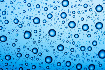 Water drop on blue background