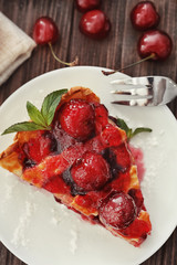 Delicious piece of cherry pie on plate
