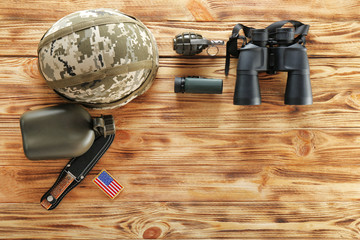 Set of military outfit on wooden background, flat lay