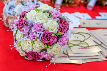 Wedding bouquetes on red background.