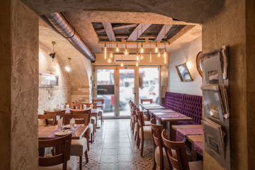 Luxuriously equipped restaurant intreior with setting tables