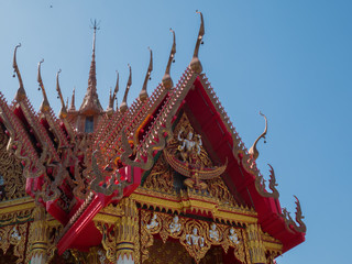 Fototapeta premium Statue of a large golden Buddha in a sitting position at Wat Tham Suea or Tham Suea temple, Kanchanaburi, Thailand.
