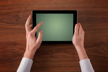 Caucasian business hands holding and working on plain tablet