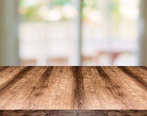 Wooden empty table board in front of blurred background. Can be used for display or montage any product. Mock up for display your product.