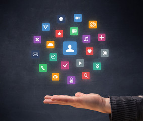 Colorful applications hovering over young hand